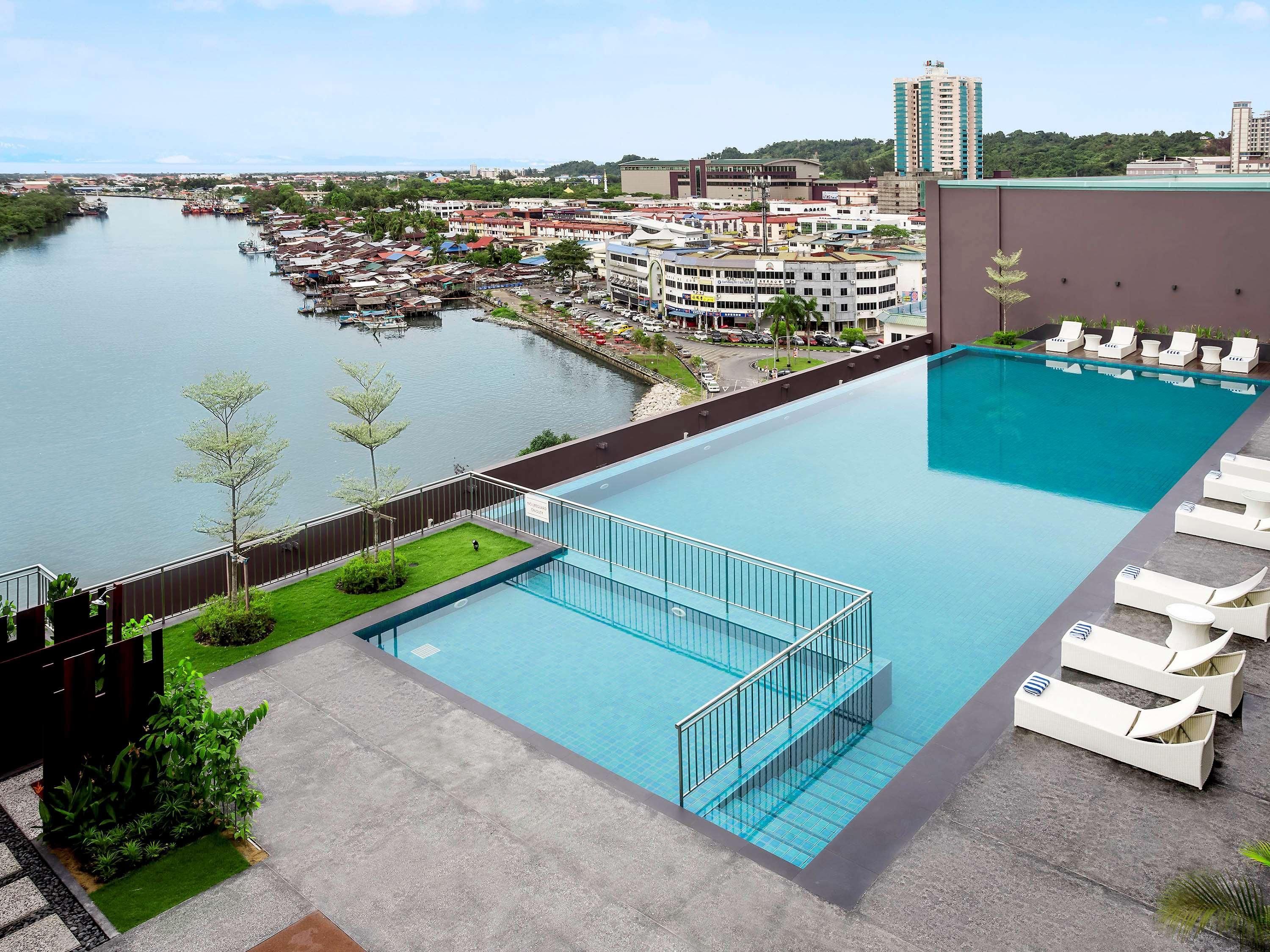 Pullman Miri Waterfront Hotel Exterior photo Infinity pool at the top of the hotel