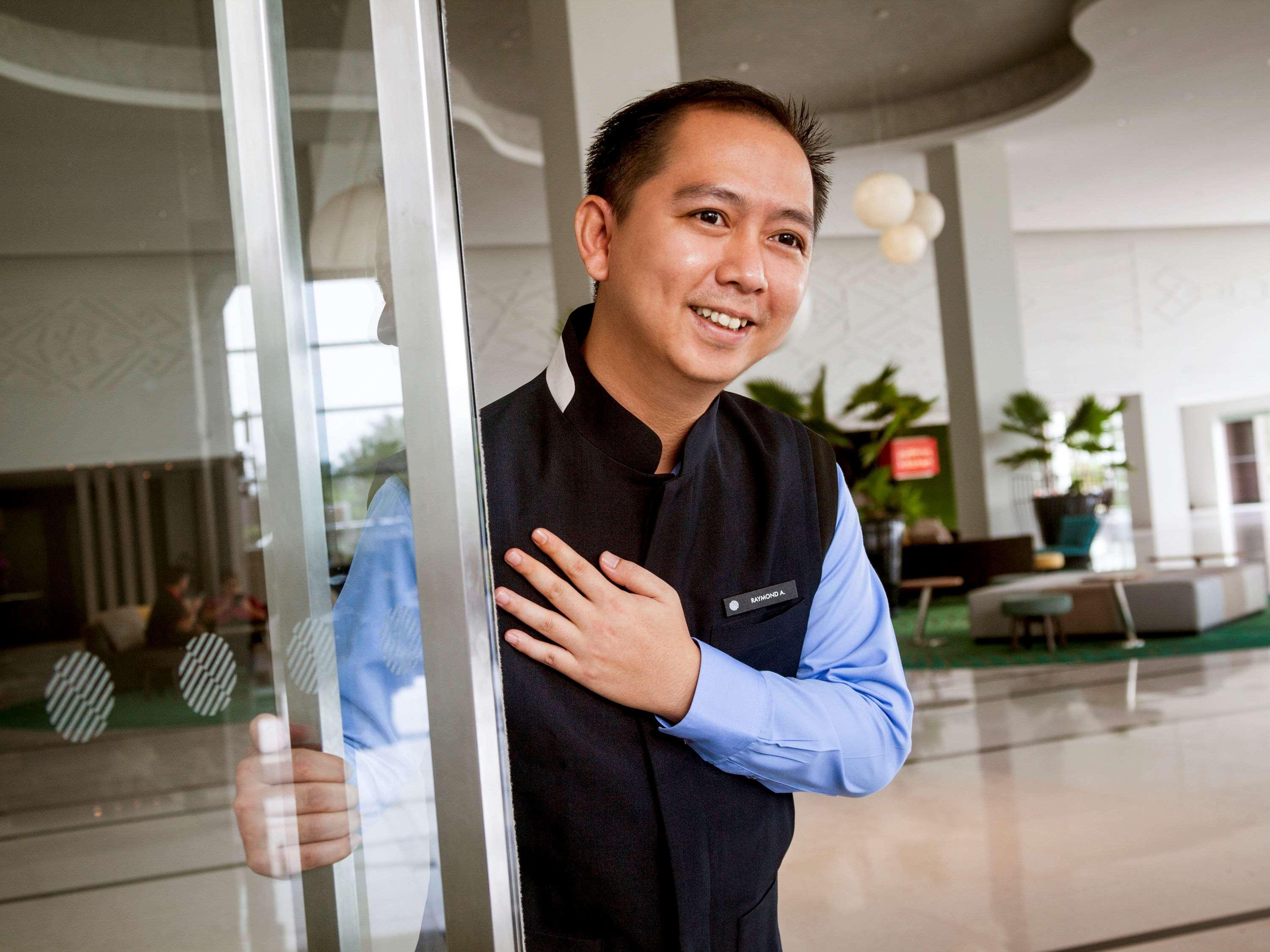 Pullman Miri Waterfront Hotel Exterior photo A doorman at a hotel in Vietnam